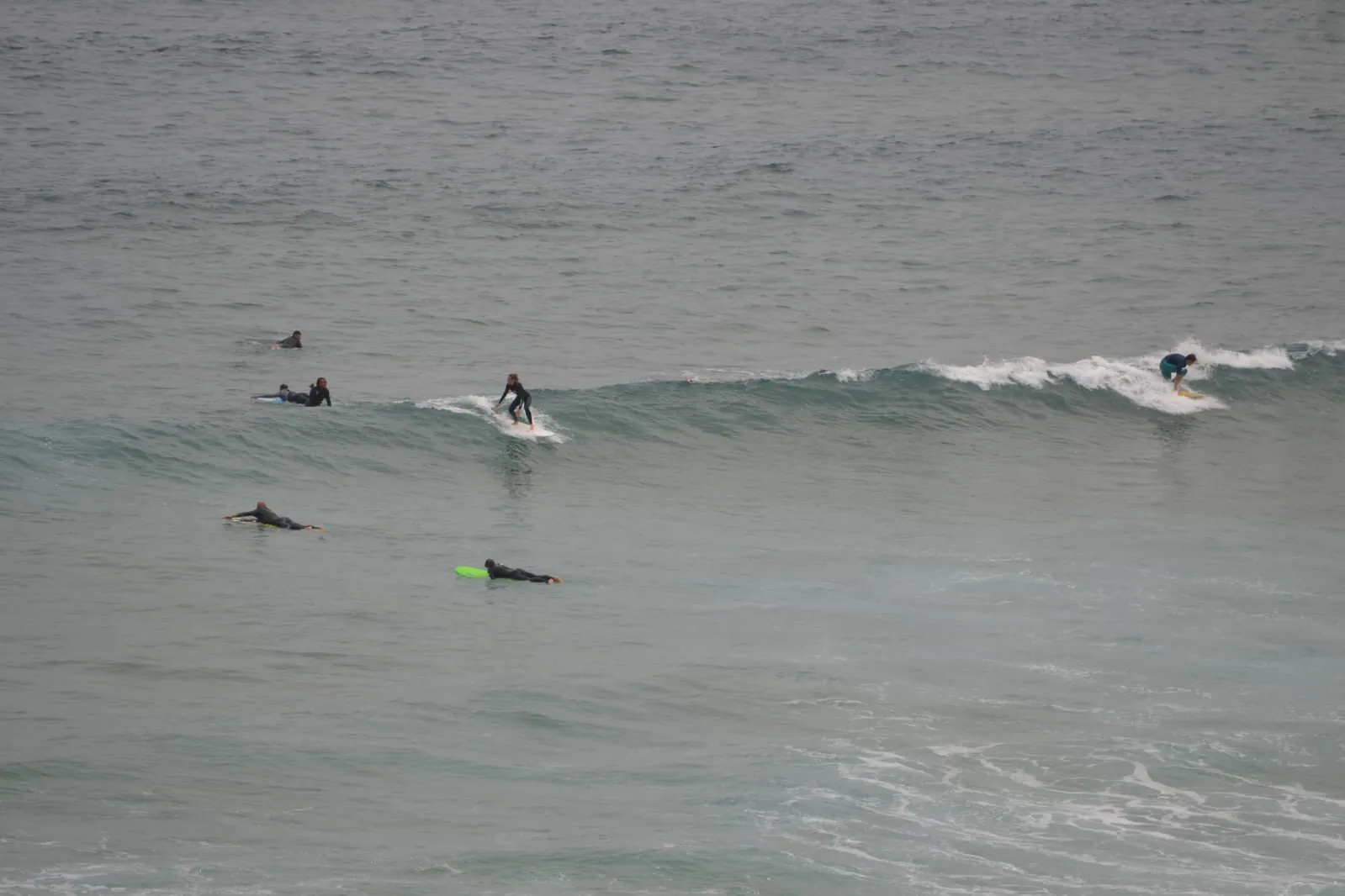 Guests in a real Taghazout surf lesson during a packaged week