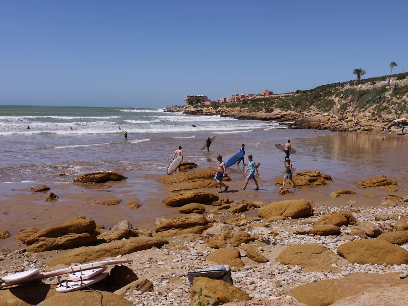 Surfers along the Taghazout coastline · location photo