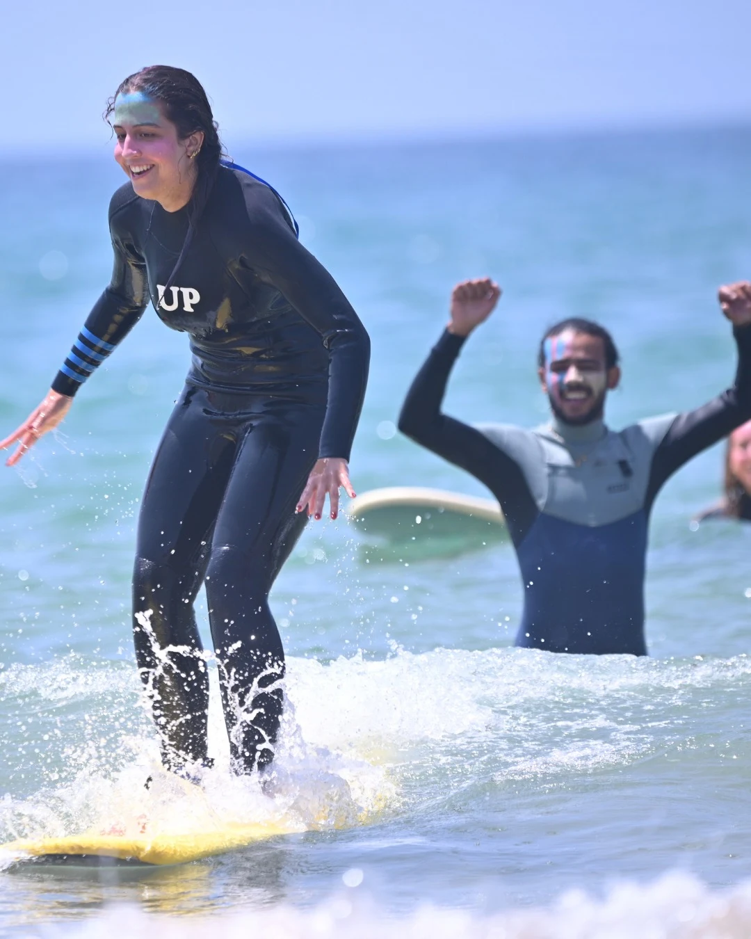 A first wave, with the surf coach close by
