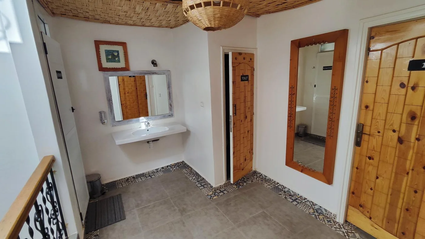 Triple Mixed Shared Room with Indoor-Facing Window